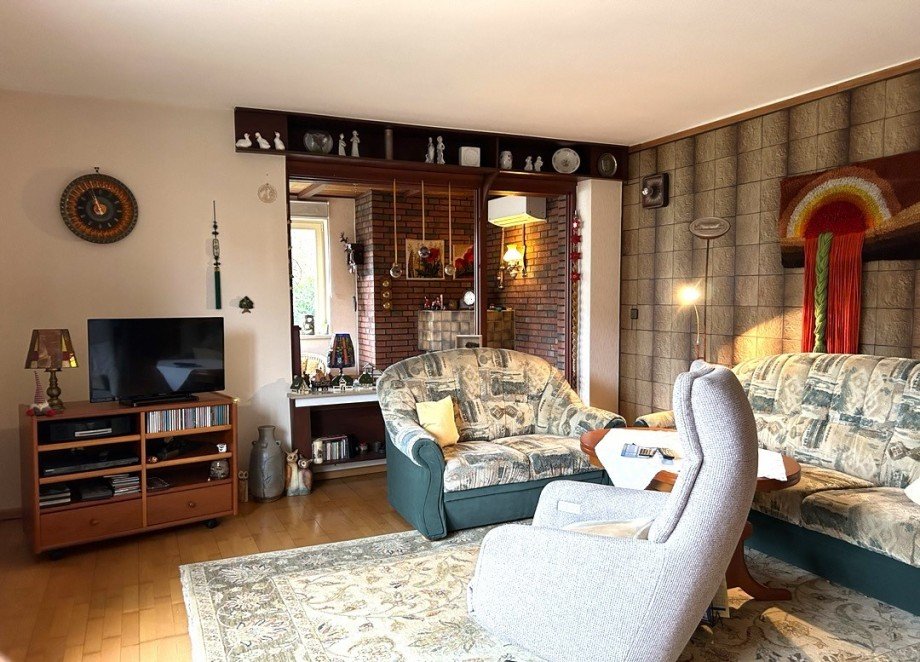 Wohnzimmer mit Blick in das Kaminzimmer Einfamilienhaus Lohne (Oldenburg)